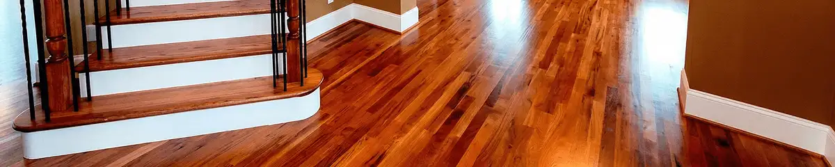Base floor of a staircase with professionally restored wood flooring in Lakewood CO