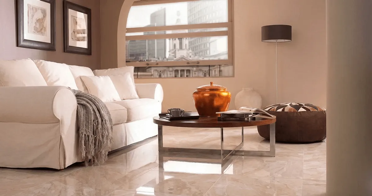 Modern living room with professionally installed marble flooring, a beige sofa, coffee table in Lakewood, CO