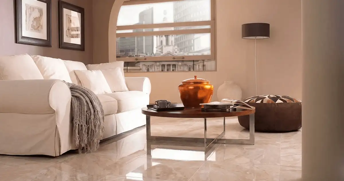 Modern living room with professionally installed marble flooring, a beige sofa, coffee table in Lakewood, CO